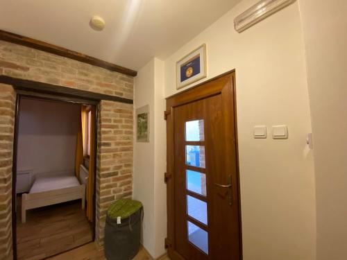 a room with a door and a room with a bed at Ubytování u Malinkovičů in Břeclav
