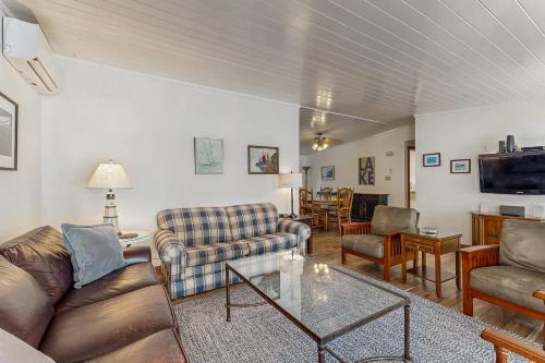 a living room with couches and a table at QKA View in Penn Yan