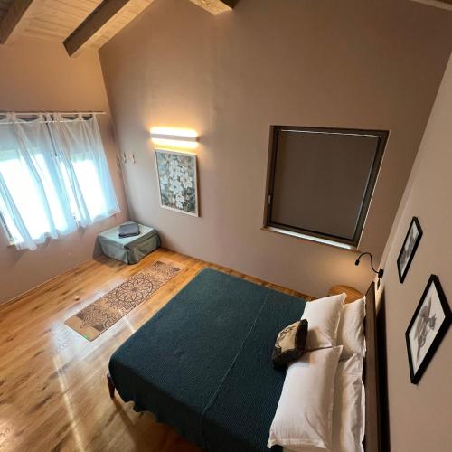a bedroom with a bed and a flat screen tv at Agriturismo Prato del Re in Prignano sulla Secchia