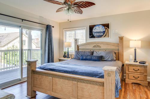 a bedroom with a bed and a large window at Private Dock, Fire Pit Lake Murray Family Escape! in Lake Murray Shores
