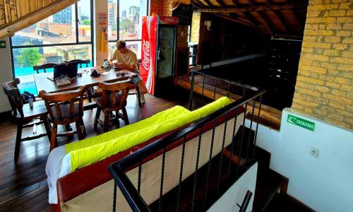 a person sitting at a table in a restaurant at Arche Noah Boutique Hostel in Bogotá