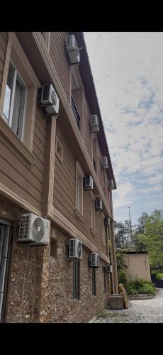 a building with air conditioners on the side of it at Guest House Kobuleti 516 in K'obulet'i