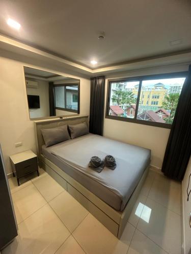 Ένα ή περισσότερα κρεβάτια σε δωμάτιο στο Arcadia beach continental