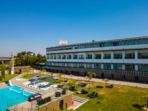 a hotel with a swimming pool and a resort at Lisotel - Hotel & Spa in Leiria