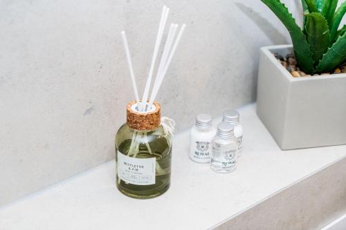 a bottle of wine on a shelf next to a plant at Dat Krautacker Huus in Rönnau