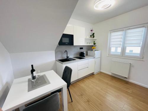 a kitchen with white cabinets and a white counter top at Villa Tajnikov in Hvar