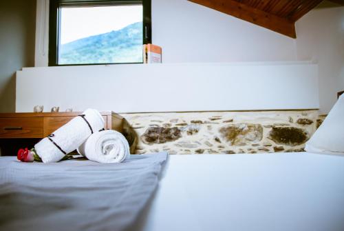 a roll of toilet paper sitting on top of a bed at Ellafos Traditional Living in Elafonisi