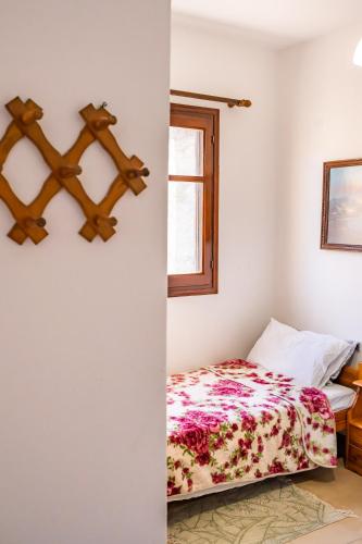 a bedroom with a bed and a window at SofiaMikeHouse in Olympos