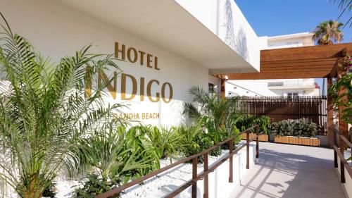 a hotel dubico sign on the side of a building at Hotel Indigo Gandia Beach by IHG in Gandía