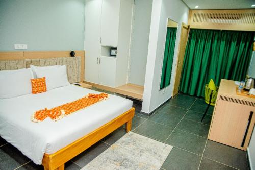 Hotel Yatchenin Yamoussoukroにあるベッド