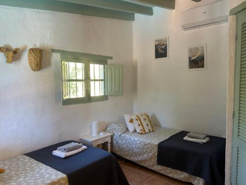 Ένα ή περισσότερα κρεβάτια σε δωμάτιο στο Cortijo Vacas Gordas B&B