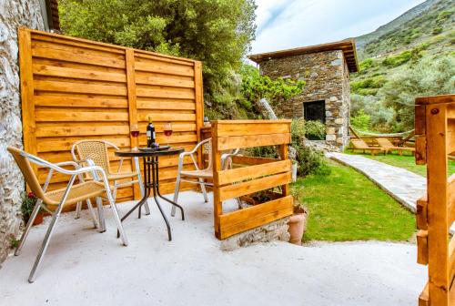 a patio with a table and chairs and a fence at Ellafos Traditional Living in Elafonisi