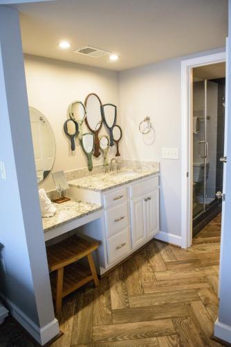 a bathroom with two sinks and mirrors on the wall at Regency Towers APT 904 in Myrtle Beach