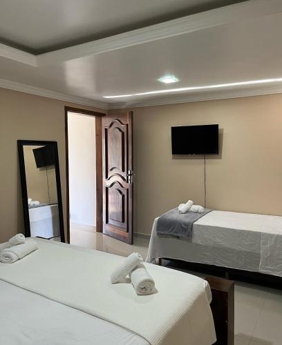 Katil atau katil-katil dalam bilik di Pousada da Luz 20v