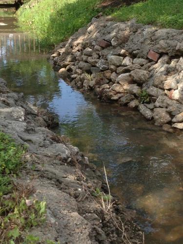 a river with rocks on the side of it at Maple Creek Bed&Breakfast in Tomball