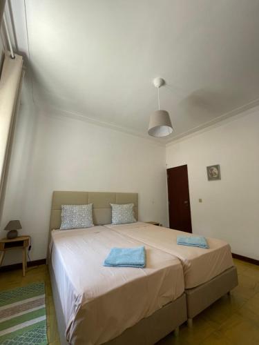 a bedroom with a large bed with two pillows on it at Casa Valverde in Monsanto