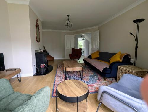a living room with a couch and a table at Cloonmonad in Westport