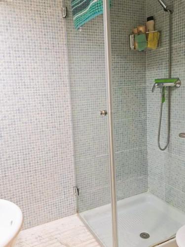 a shower with a glass door in a bathroom at Paradise Javea in Jávea