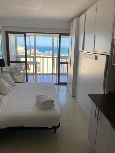 Ένα ή περισσότερα κρεβάτια σε δωμάτιο στο Great Hostels Apartments Carihuela