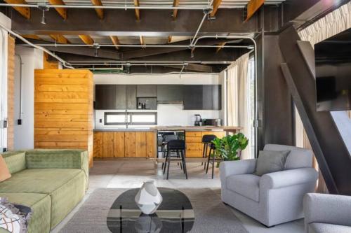 a living room with a couch and a table at Argentina by Pardela - LOFT nuevo Colonia Americana in Guadalajara