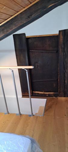 a table in a room with a wooden wall at Chalet Bernadette in Mörel
