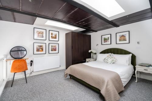 Postel nebo postele na pokoji v ubytování Central Oasis