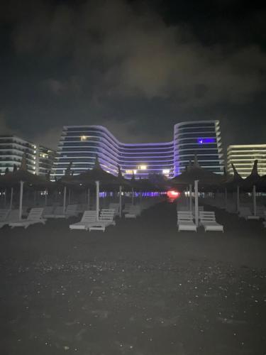 a view of a hotel at night with buildings at Luxury by WhiteTitanicBreeze in Năvodari