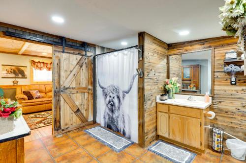 a bathroom with a shower with a picture of a dog at Quiet Eagar Retreat Near Lakes, Hiking and Hunting! in Springerville