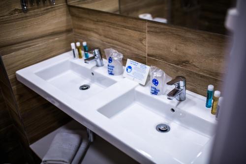 a bathroom with a white sink and a mirror at IG Nachosol Atlantic & Yaizasol by Servatur - Adults Only in Puerto Rico de Gran Canaria