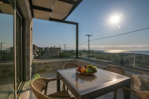 a bowl of fruit on a table on a balcony at Elafonisi Pearl in Elafonisi