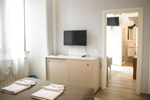 TV a/nebo společenská místnost v ubytování Il corso