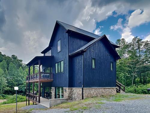 a black house with a gambrel roof at Smoky Ridge Sanctuary in Sevierville