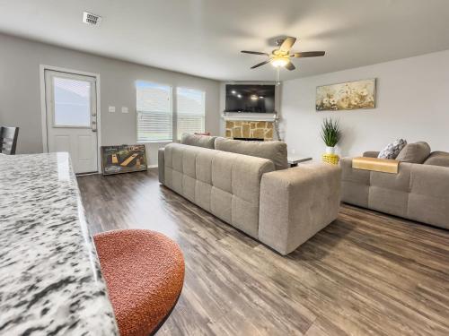 a living room with two couches and a fireplace at Little Elm Getaway in Little Elm