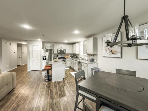 a kitchen and living room with a table and a couch at Little Elm Getaway in Little Elm