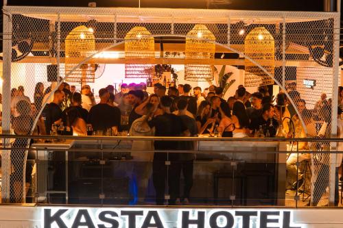 a crowd of people standing at a bar at Kasta Beach Hotel in Ofrínion