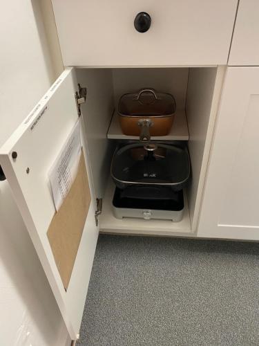 a cabinet with a toilet in the middle of it at Our Place Up North BnB in Huntsville