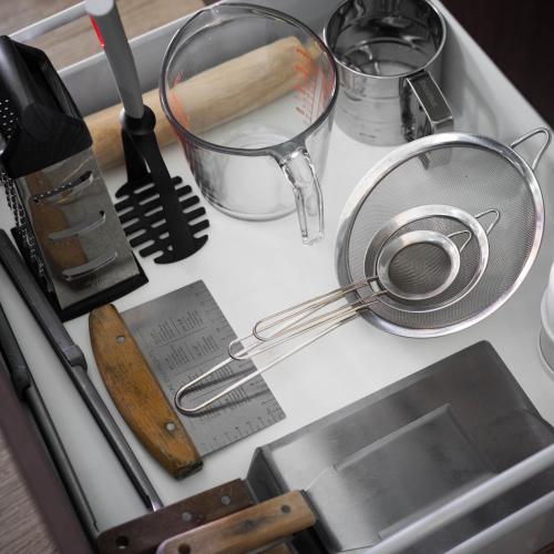 a kitchen counter with a sink with utensils and a strainer at KING BED & HOT TUB in Cloud Forest Mountains with WIFI, Volcán, Panama in Nueva California