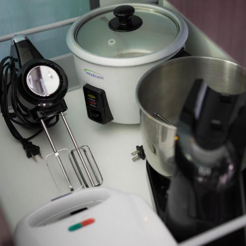 a kitchen counter with a mixer and a camera on it at KING BED & HOT TUB in Cloud Forest Mountains with WIFI, Volcán, Panama in Nueva California