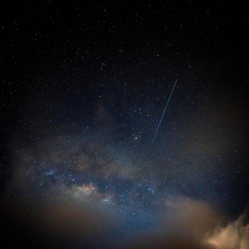 a plane is flying through the night sky at KING BED & HOT TUB in Cloud Forest Mountains with WIFI, Volcán, Panama in Nueva California