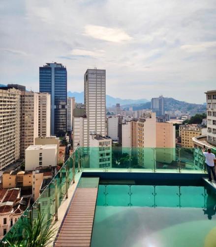a view of the city from the rooftop of a building at Studio Residencial Casa Mauá III in Rio de Janeiro