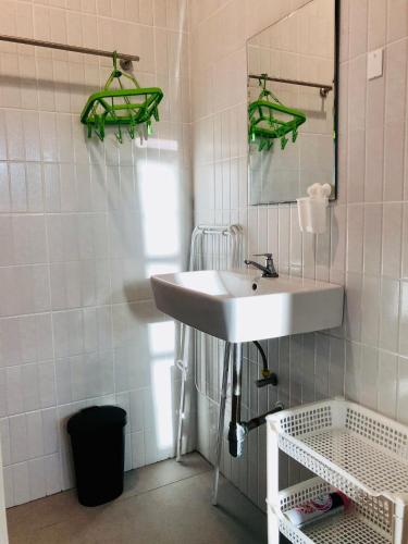 a bathroom with a sink and a mirror at BAAN JUBJUB Chaloklum in Chaloklum