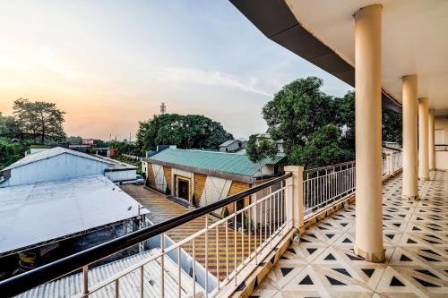 a balcony with a view of a train station at Super Capital O Gulmohar Marriage Garden in Dhanbād