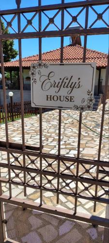 a sign for a sylvarius house on a gate at Erifily's House in Nea Kalikratia