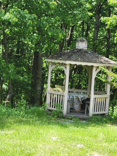 a gazebo in the grass in a yard at The Kalli-Ru near Golf, Ohiopyle, Fallingwater 