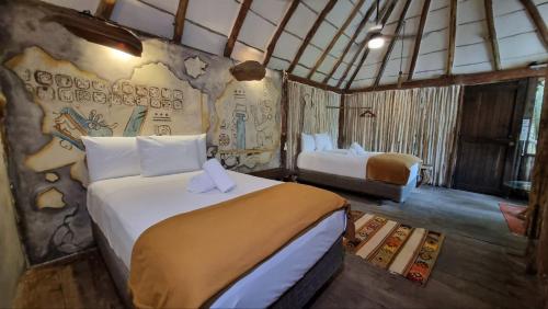 Postel nebo postele na pokoji v ubytování HIPPIE CHIT jungle House