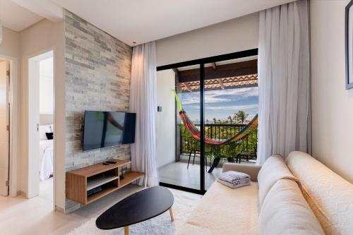 TV a/nebo společenská místnost v ubytování Miami House Cumbuco por Carpediem