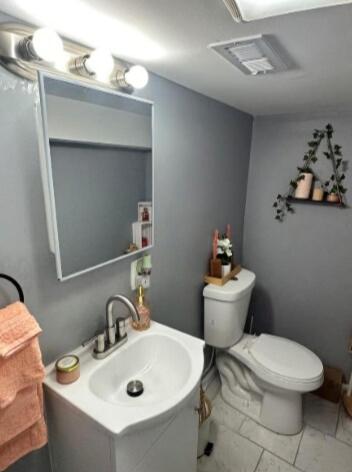 a bathroom with a sink and a toilet and a mirror at The Jazzy Jeffrey Gem in Baltimore