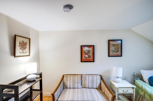 a living room with a chair and a bed at Steps to Downtown Stockbridge Home with Patio! in Stockbridge