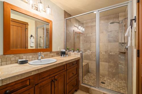 a bathroom with a sink and a shower at The Porches in Steamboat Springs