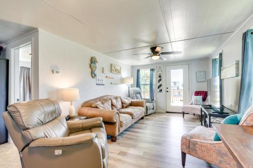 a living room with leather furniture and a couch at 2 Mi to Public Beach Pet-Friendly Freeport Home! in Freeport